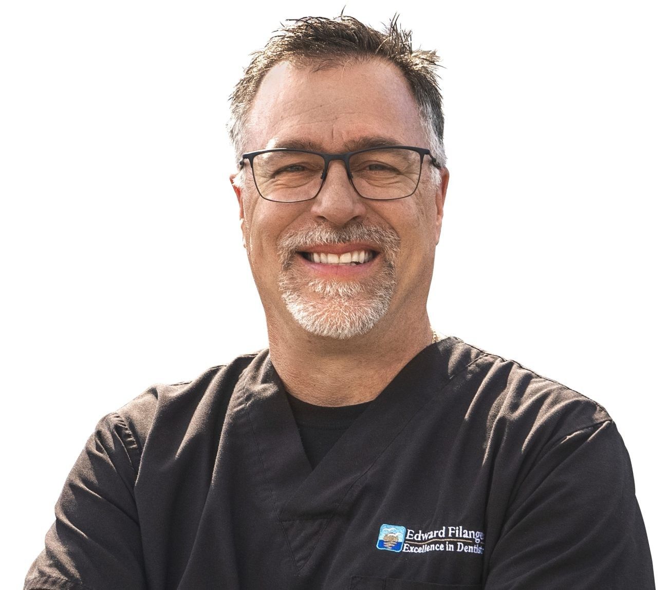 Dr. Ed Filangeri smiling, in dark scrubs